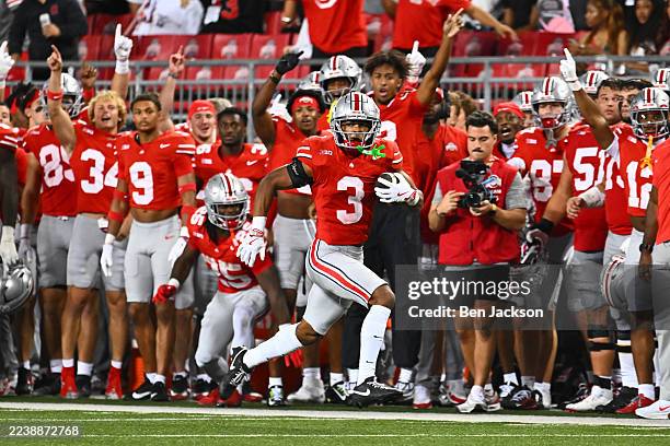 Lorenzo Styles Jr. #3 of the Ohio State Buckeyes runs with the ball in the third quarter of a game against the Minnesota Golden Gophers at Ohio...