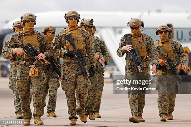 Marines walk through America's Air Show after a demonstration at Marine Corps Air Station Miramar on September 26, 2025 in San Diego, California.