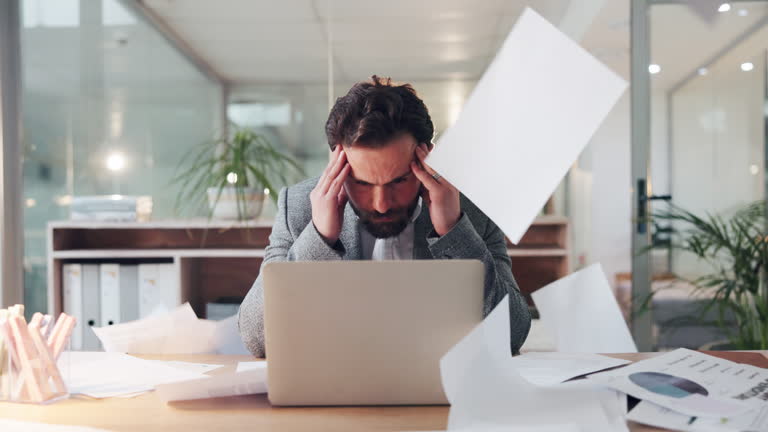 https://media.gettyimages.com/id/2238926877/video/business-man-chaos-and-laptop-with-headache-in-office-falling-papers-and-pressure-with.jpg?b=1&s=640x640&k=20&c=JjIV54mzRVii9sR1eeh2lmrQRfs3cH8L1uk8AN0Ku_A=