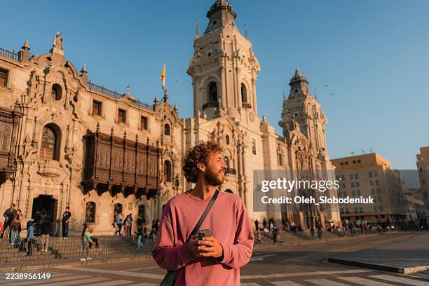 man walking on plaza del armas in lima, peru - lima peru stock pictures, royalty-free photos & images