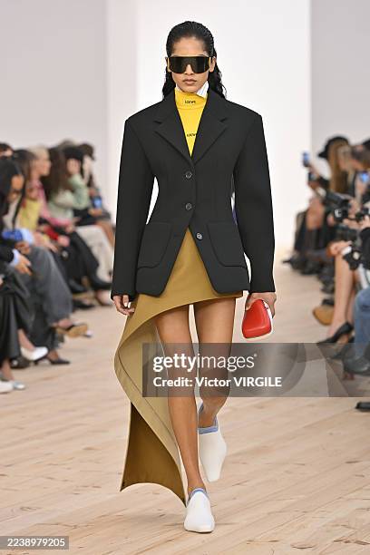 Model walks the runway during the Loewe Ready to Wear Spring/Summer 2026 fashion show as part of the Paris Fashion Week on October 3, 2025 in Paris,...