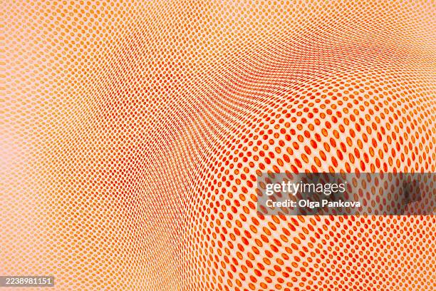 orange halftone pattern creating dynamic optical illusion - morphing stock pictures, royalty-free photos & images