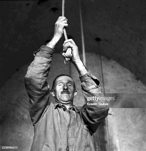 Monthey, bell ringer in the church, 1945.