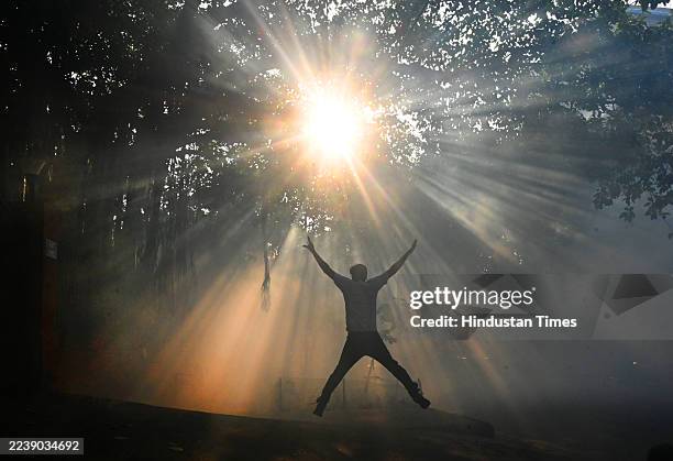 Man doing exercise after an NDMC fumigatus to prevent mosquito borne diseases at society, on October 5, 2025 in New Delhi, India.