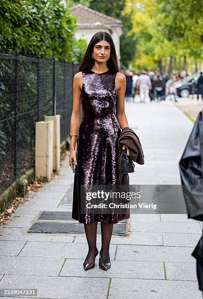 Guest wears sequined dress outside Loewe during the Womenswear Spring Summer 2026 as part of Paris Fashion Week on October 03, 2025 in Paris, France.