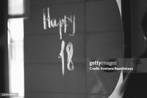 happy 18 message written on bathroom mirror - vanity mirror stock pictures, royalty-free photos & images