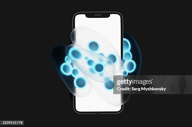 close-up of smartphone surrounded by glowing blue bacteria on black background - enterobacter aerogenes stock pictures, royalty-free photos & images