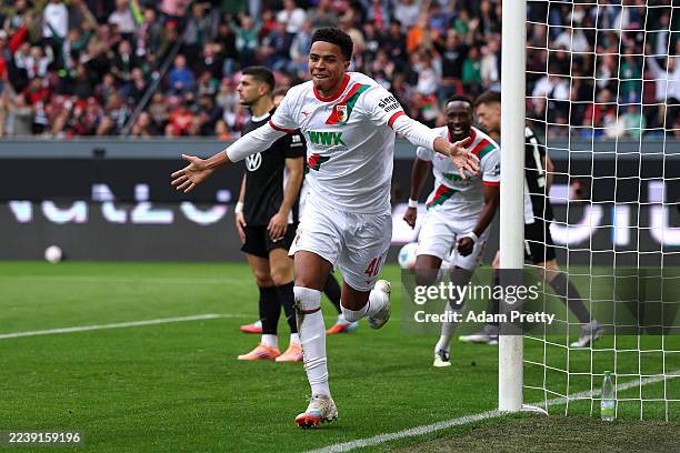 Noahkai Banks of Augsburg celebrates scoring his team's first goal during the Bundesliga match between FC Augsburg and VfL Wolfsburg at WWK-Arena on...