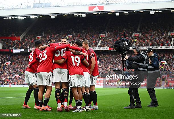 Benjamin Sesko of Manchester United celebrates scoring his team's second goal with teammates during the Premier League match between Manchester...