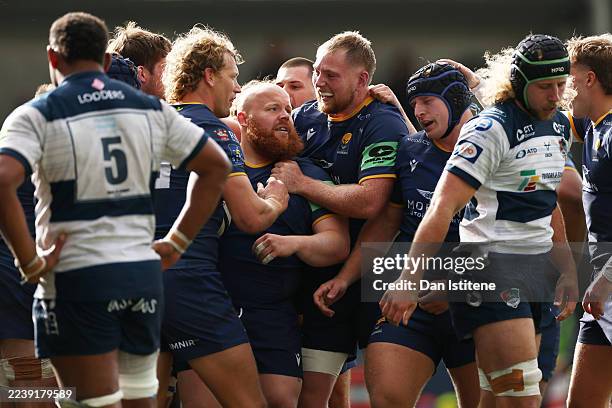 Ashley Challenger of Worcester celebrates with team-mates after scoring a late try during the Champ Rugby match between Worcester Warriors and...