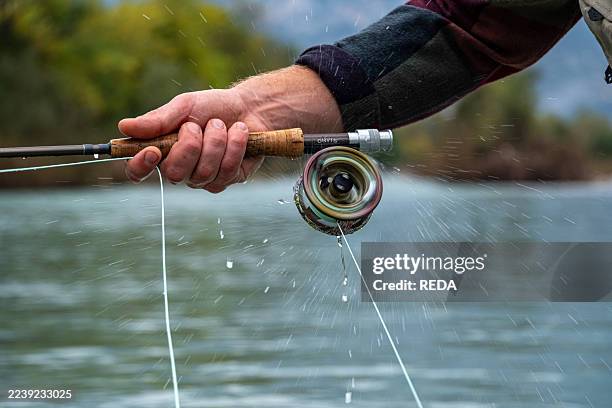Andrea Tavernini while fishing in the lower Sarca, Trentino, Italy, Europe.