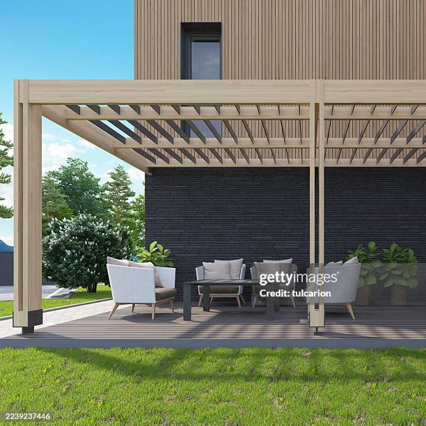 scandi-style patio with wooden pergola and outdoor lounge - brick patio stock pictures, royalty-free photos & images