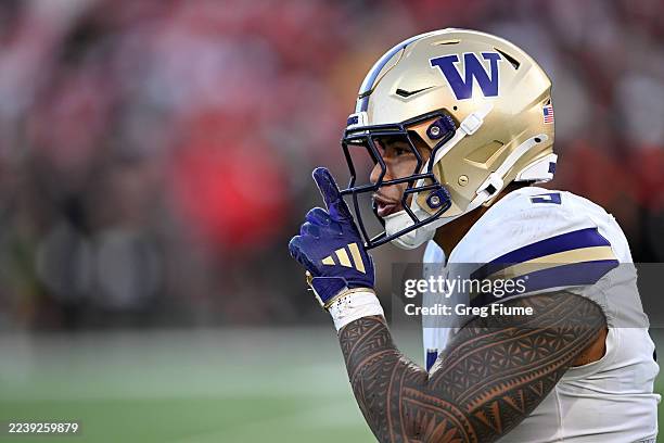Jacob Manu of the Washington Huskies celebrates after a defensive stop in the fourth quarter against the Maryland Terrapins at SECU Stadium on...