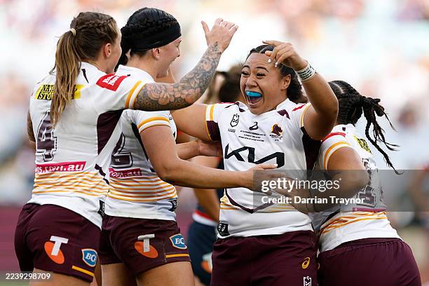 Shalom Sauaso of the Broncos celebrates with team mates after scoring a try during the NRLW Grand Final match between the Sydney Roosters and...