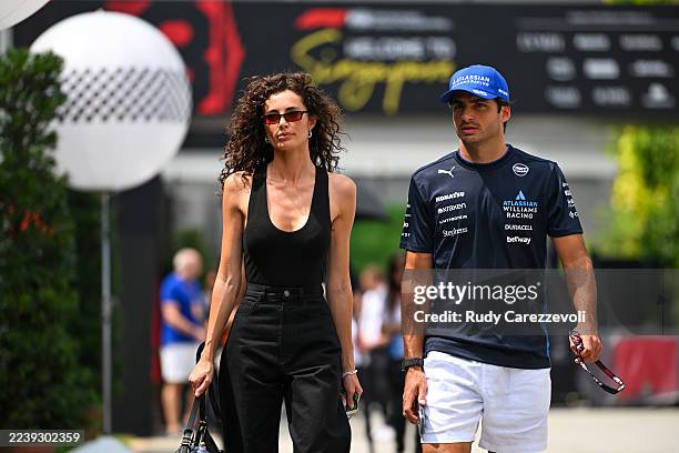 Carlos Sainz of Spain and Williams and Rebecca Donaldson arrive in the Paddock prior to the F1 Grand Prix of Singapore at Marina Bay Street Circuit...