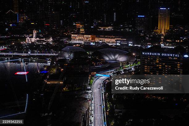George Russell of Great Britain driving the Mercedes AMG Petronas F1 Team W16 leads Max Verstappen of the Netherlands driving the Oracle Red Bull...