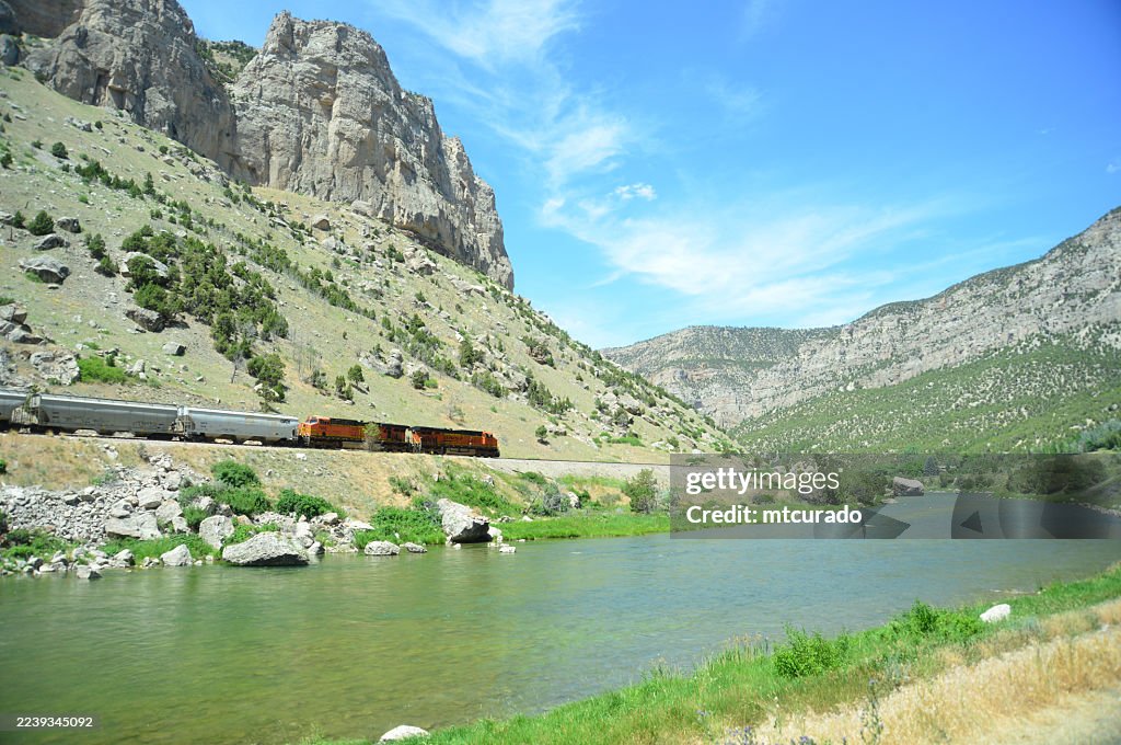 Wind River and train in the BNSF Casper Subdivision railway line, Wind River Indian Reservation, Hot Springs County, Wyoming