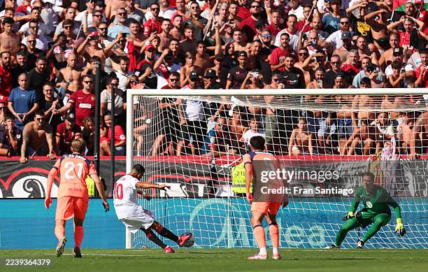 Alexis Sanchez of Sevilla FC scores his team's first goal from the penalty spot during the LaLiga EA Sports match between Sevilla FC and FC Barcelona...