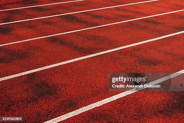 a close-up of a running track at a stadium. sport concept. - running track stock pictures, royalty-free photos & images