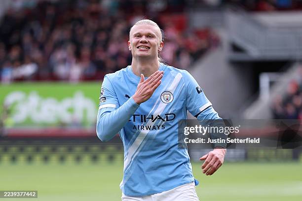 Erling Haaland of Manchester City celebrates scoring his team's first goal during the Premier League match between Brentford and Manchester City at...