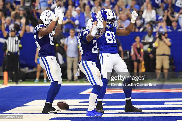 Jonathan Taylor of the Indianapolis Colts celebrates with teammates after a touchdown during the third quarter against the Las Vegas Raiders in the...