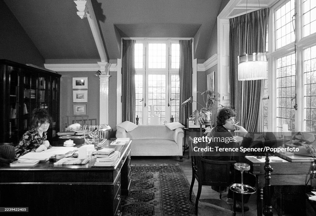 Playwright Tom Stoppard And His Wife Working At Their Desks