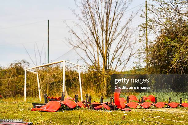 abandoned soccer field with broken stadium seats - bad condition stock pictures, royalty-free photos & images