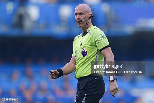 Referee Anthony Taylor is seen wearing a 'refcam' camera during the Premier League match between Chelsea and Liverpool at Stamford Bridge on October...