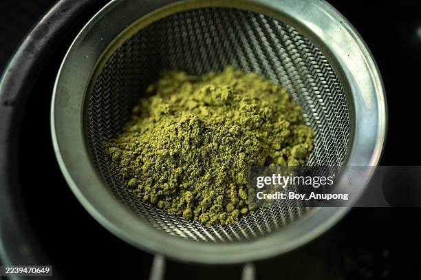 Close Up Of Matcha Powder In Sieve Preparing For Make Beverages High-Res Stock Photo
