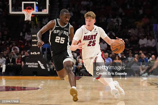 Kasparas Jakucionis of the Miami Heat drives to the basket during the game against the San Antonio Spurs on October 8, 2025 at Kaseya Center in...