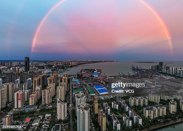 Rainbow hangs in the sky above buildings after typhoon Matmo on October 6, 2025 in Haikou, Hainan Province of China.
