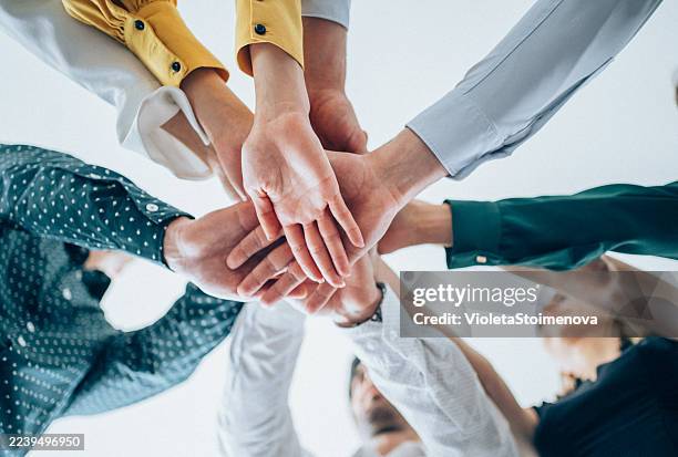 motivating the team. - sea of hands stock pictures, royalty-free photos & images