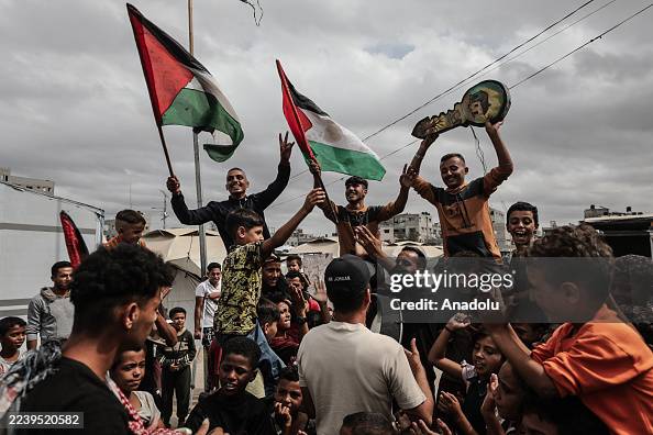 Palestinians celebrate ceasefire announcement in Nuseirat refugee camp Palestinians celebrate ceasefire announcement in Nuseirat refugee camp