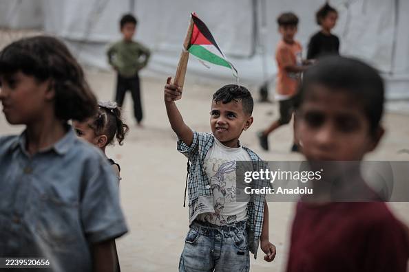 Palestinians celebrate ceasefire announcement in Nuseirat refugee camp Palestinians celebrate ceasefire announcement in Nuseirat refugee camp