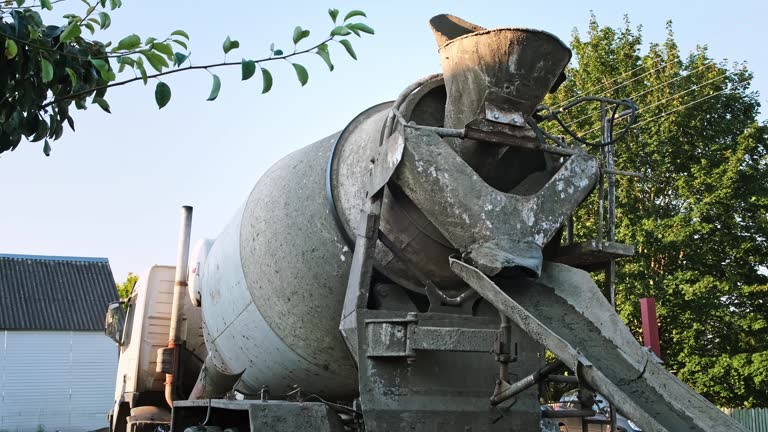 https://media.gettyimages.com/id/2239545540/video/the-concrete-mixer-truck-rotates-the-cement-mixture-side-back-view-special-vehicles-for.jpg?b=1&s=640x640&k=20&c=8EAawYl1FppbeG8f-3oDuCpbWgKC8MJlt-JZA_elGKI=