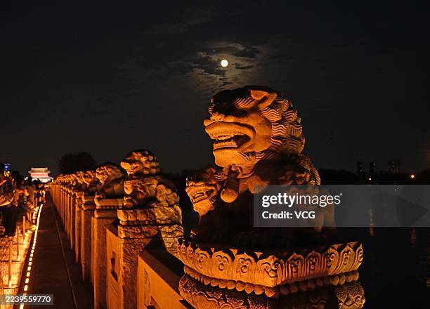 Supermoon lights up the night sky over Lugou Bridge during the Mid-Autumn Festival on October 6, 2025 in Beijing, China. This year's Mid-Autumn...