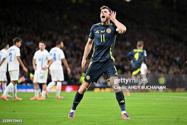 Scotland's striker Ryan Christie celebrates scoring the team's first goal during the 2026 World Cup Group C qualifier football match between Scotland...