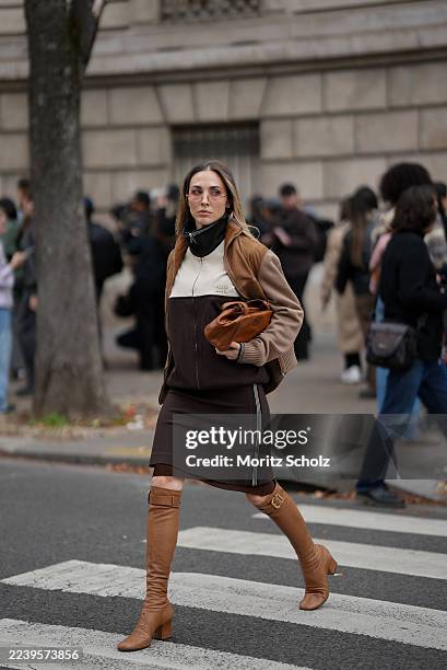 Ann-Kathrin Götze, attending the Miu Miu show during Paris Fashion Week Spring/Summer 2026, is seen wearing a two-tone zip-up bomber jacket in...