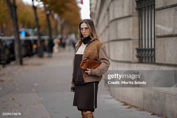 Ann-Kathrin Götze, attending the Miu Miu show during Paris Fashion Week Spring/Summer 2026, is seen wearing a two-tone zip-up bomber jacket in...