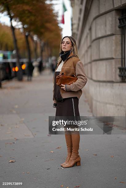 Ann-Kathrin Götze, attending the Miu Miu show during Paris Fashion Week Spring/Summer 2026, is seen wearing a two-tone zip-up bomber jacket in...