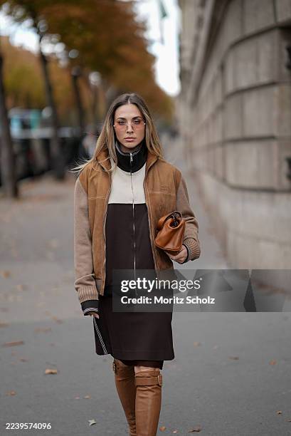 Ann-Kathrin Götze, attending the Miu Miu show during Paris Fashion Week Spring/Summer 2026, is seen wearing a two-tone zip-up bomber jacket in...