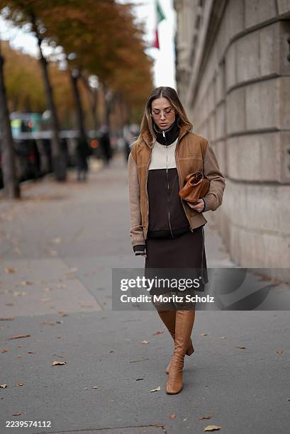 Ann-Kathrin Götze, attending the Miu Miu show during Paris Fashion Week Spring/Summer 2026, is seen wearing a two-tone zip-up bomber jacket in...