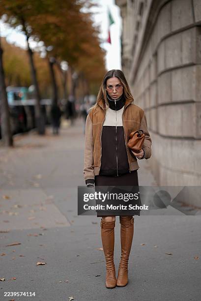 Ann-Kathrin Götze, attending the Miu Miu show during Paris Fashion Week Spring/Summer 2026, is seen wearing a two-tone zip-up bomber jacket in...