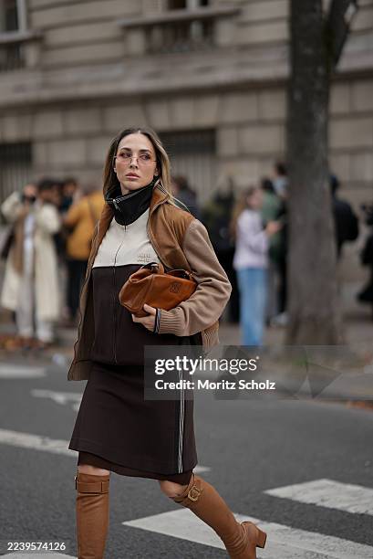 Ann-Kathrin Götze, attending the Miu Miu show during Paris Fashion Week Spring/Summer 2026, is seen wearing a two-tone zip-up bomber jacket in...