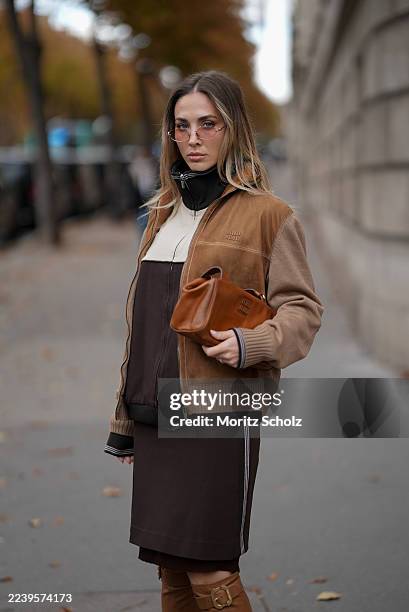 Ann-Kathrin Götze, attending the Miu Miu show during Paris Fashion Week Spring/Summer 2026, is seen wearing a two-tone zip-up bomber jacket in...