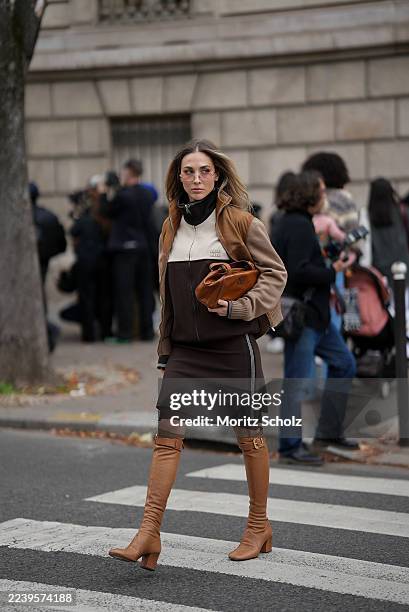 Ann-Kathrin Götze, attending the Miu Miu show during Paris Fashion Week Spring/Summer 2026, is seen wearing a two-tone zip-up bomber jacket in...