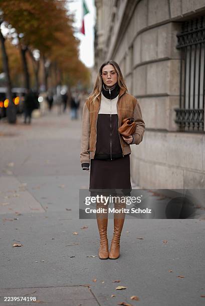 Ann-Kathrin Götze, attending the Miu Miu show during Paris Fashion Week Spring/Summer 2026, is seen wearing a two-tone zip-up bomber jacket in...
