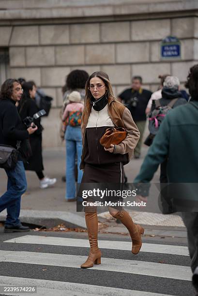 Ann-Kathrin Götze, attending the Miu Miu show during Paris Fashion Week Spring/Summer 2026, is seen wearing a two-tone zip-up bomber jacket in...