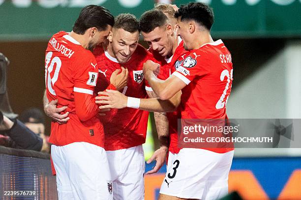Austria's forward Marko Arnautovic celebrates with team mates after scoring the 10:0 goal during the FIFA World Cup 2026 Group H European...