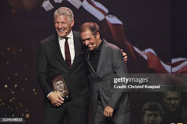 Philipp Lahm honours Bastian Schweinsteiger during the Hall Of Fame award ceremony 2025 at Deutsches Fussballmuseum on October 06, 2025 in Dortmund,...
